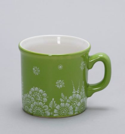 A small green mug